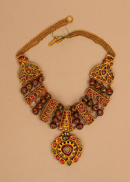 Gold necklace flatlay